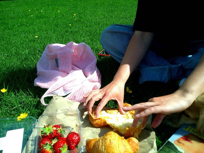 Croissants and strawberries on a picnic